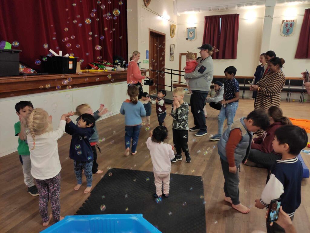 Waitaki Multicultural Playgroup - Children enjoying bubbles