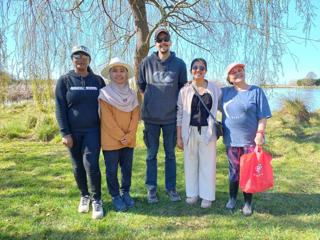 Group Photo of people standing in front of a tree at Borton's Pond
